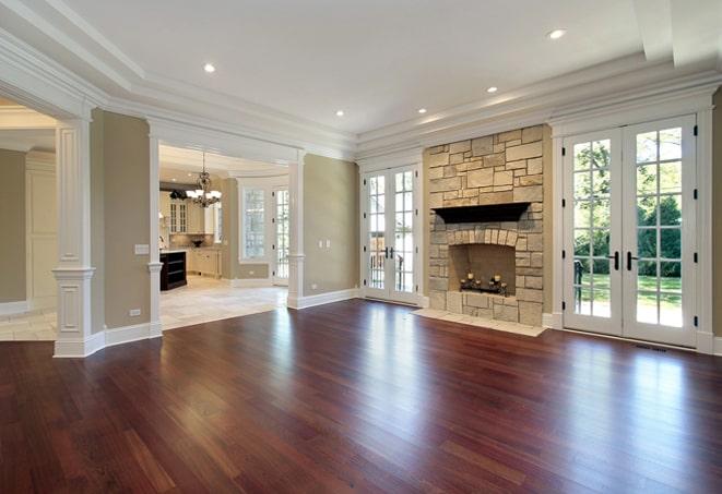 dark, hand-scraped wood floors in a cozy den